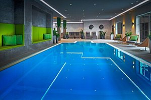 Vysoké Taury 300 m od sjezdovky: Hotel ever.grün KAPRUN **** s polopenzí, wellness a fitness + skibus a sleva